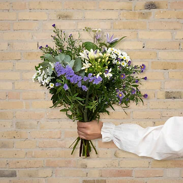 Send en tak for dig blomsterbuket i smukke lilla og hvide farver
